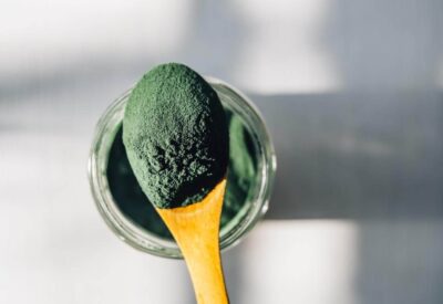 spirulina powder on a spoon
